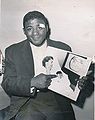 1956 Floyd Patterson with Photo of Newborn Baby.JPG