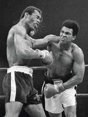Ali lands a right against Norton.