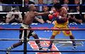 Another straight punch from Mayweather catches Pacquiao flush.jpg