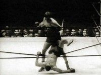File:Buddy Baer knocks Joe Louis out of the ring.jpg
