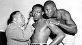 Johnny Saxton looks on as Kid Gavilan.jpg