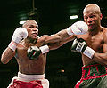Mayweather jabs Judah.jpg