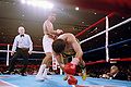 Michael Carbajal stands by as his opponent Chiquita Gonzales falls to the canvas.jpg