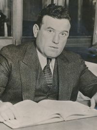 File:Packey McFarland working at a bank in 1930.JPG