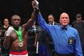 RAISING BERTO'S ARM AS THE WINNER.jpg