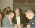 Ross -Gordie Howe -Steve Mac Neil check out gold watch at big night for Rockabye.jpg
